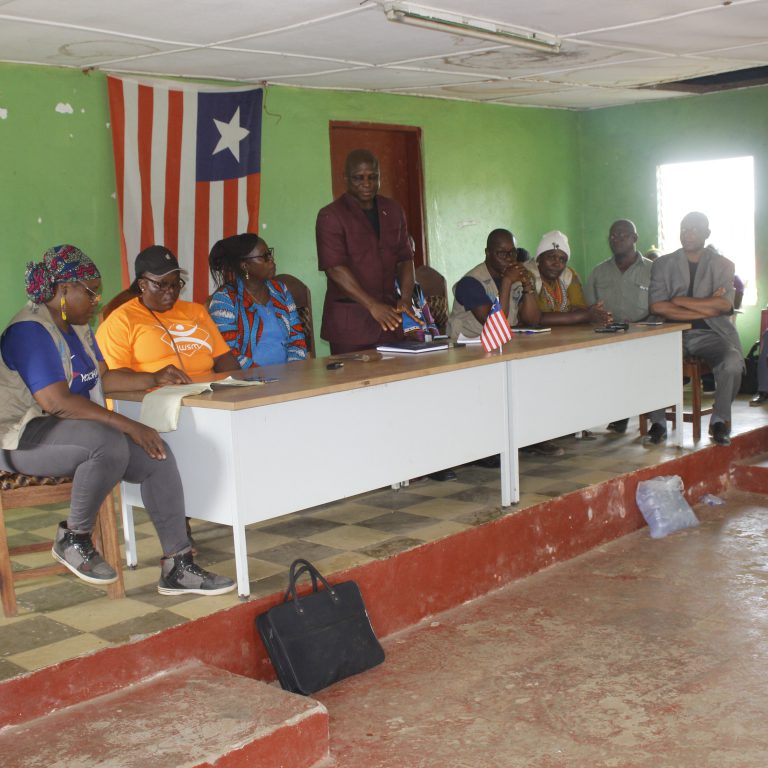 From left to right: Executive Secretary, Family Health Director, Minister of Health, Superintendent, Community Health Director, County Health Director